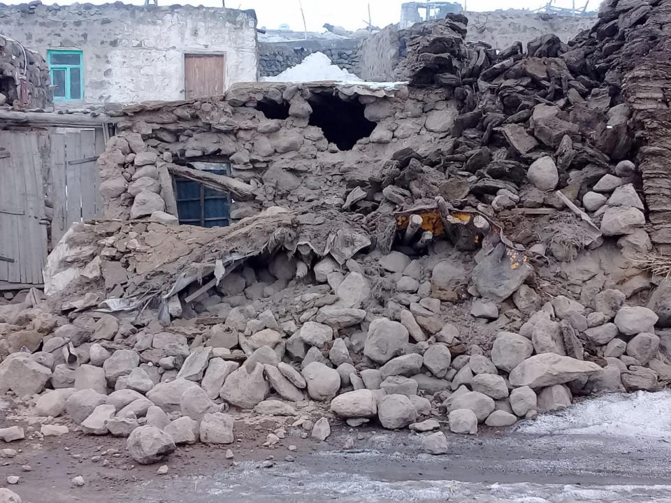 Houses are reduced to rubble after an earthquake hit villages in Baskale in Van province, Turkey, at the border with Iran, Sunday, Feb. 23, 2020. Turkish Interior Minister Suleyman Soylu said numerous people have been killed and several others wounded in Sunday's quake with more people trapped under debris. (IHA via AP)