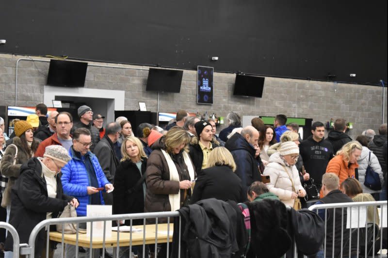 Iowa Republican caucus-goers check in at the Horizon Event Center in Clive, Iowa, on Monday. Photo by Joe Fisher/UPI