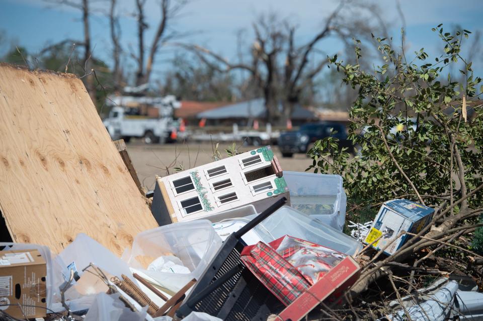 A doll house sits atop a pile of storm debris in Rolling Fork, Miss., Wednesday, March 29, 2023. An EF-4 tornado destroyed the small southern Delta town last Friday.