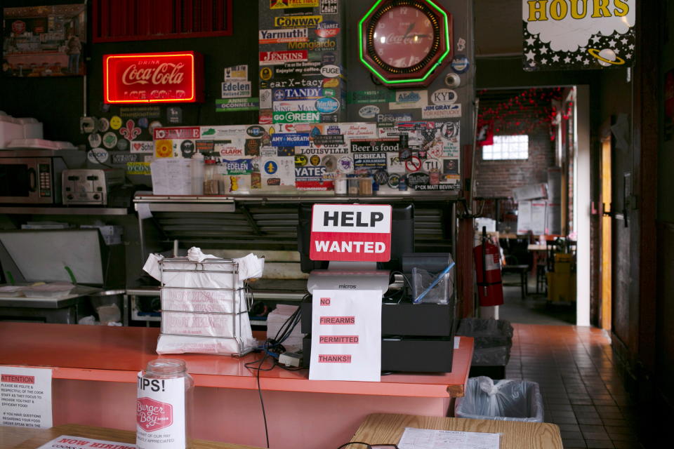 A hiring sign is seen at the register of Burger Boy restaurant, as many restaurant businesses face staffing shortages in Louisville, Kentucky, U.S., June 7, 2021. Picture taken June 7, 2021.  REUTERS/Amira Karaoud