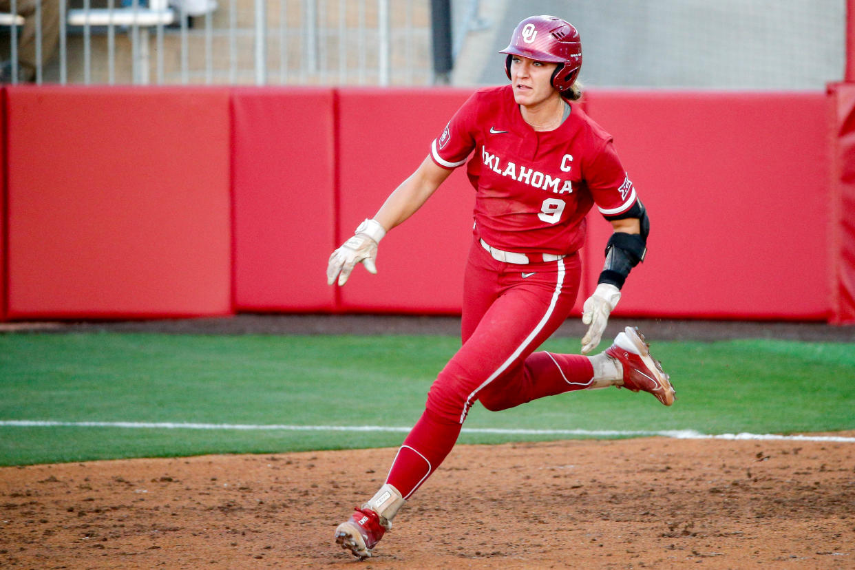 Oklahoma catcher Kinzie Hansen (9) rounds first for a double during an NCAA softball game between Oklahoma (OU) and Liberty on opening day of Oklahoma softball stadium Love's Field in Norman, Okla., on Friday, March 1, 2024.