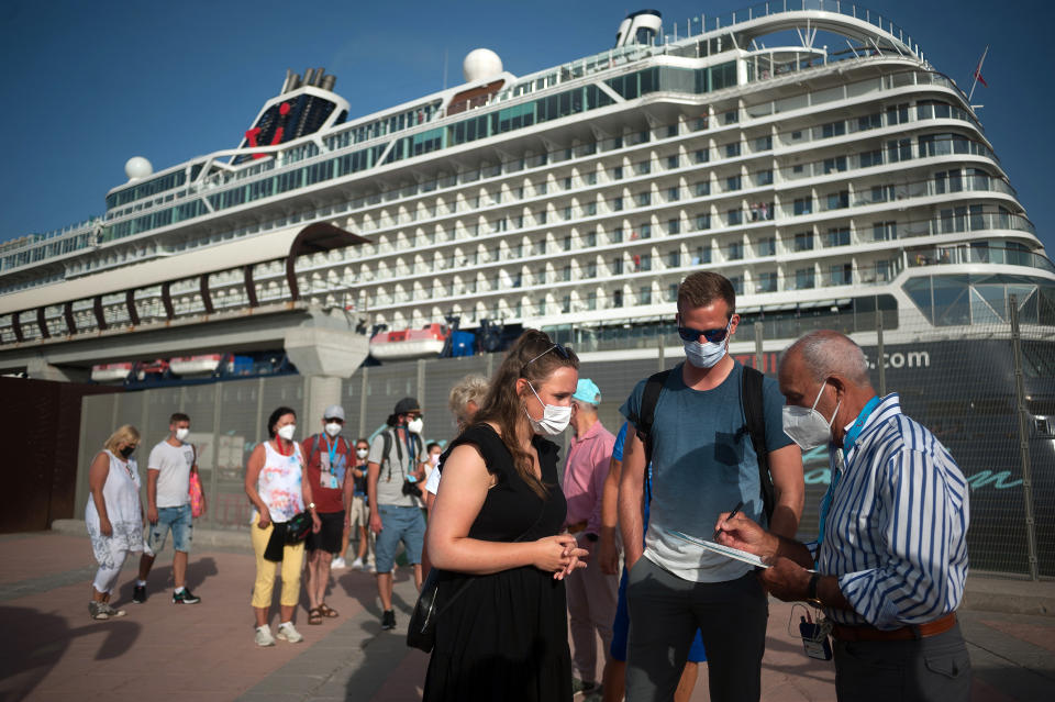 MALAGA, SPAIN - 2021/06/15: German tourists in queue waiting to enter a tourist bus after disembarking from the cruise ship.
The German cruise ship 'Mein Shiff 2', of ship owner 'TUI cruises' arrived at Malaga Port with passengers on board after the return of international cruises to Spain. The Malaga port is the first peninsular harbor to welcome a cruise ship since the beginning of the coronavirus pandemic and mobility restrictions. More than 1000 passengers will enjoy trips to the downtown city through support bubbles groups allowing only excursions organized by TUI cruises for their travelers, as a measure to prevent the spread of coronavirus disease. (Photo by Jesus Merida/SOPA Images/LightRocket via Getty Images)