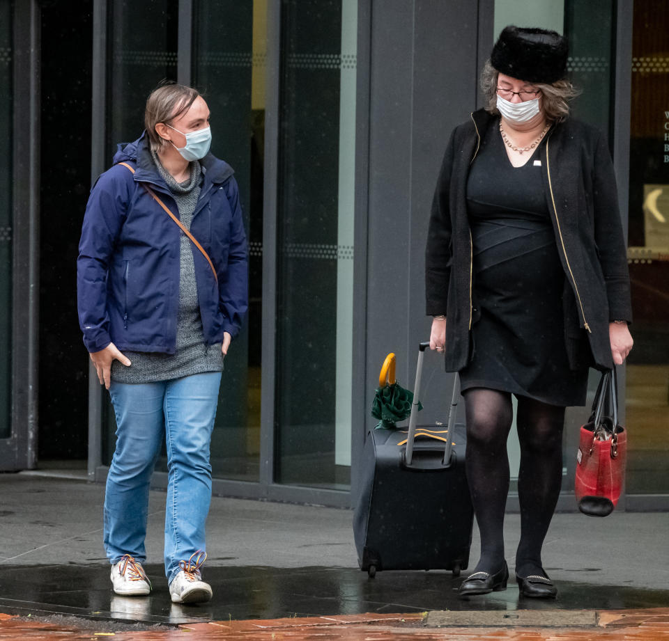 Rose Taylor (L) leaves the Centre City Tower, Birmingham, October 2, 2020.  A gender-fluid engineer who was bullied for wearing women's clothes at Jaguar Land Rover has been awarded Â£180,000 after winning a landmark discrimination case.  See SWNS story SWMDgender.  Rose Taylor, was teased and harassed by workmates at the car manufacturer after she began identifying as gender fluid/non-binary in 2017.  An employment tribunal heard how she suffered insults and abusive jokes at the hands of cruel colleagues and received no support from her management.  