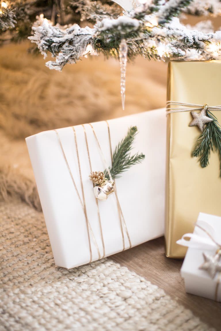 <p>Wrap a thin piece of gold ribbon around your present a few times for this cool effect. Then, stick on pine branches and a little ornament for a simple, festive look.</p><p><strong>Get the tutorial at <a href="https://justdestinymag.com/diy-gift-wrap-ideas/" rel="nofollow noopener" target="_blank" data-ylk="slk:Just Destiny" class="link ">Just Destiny</a>.</strong> </p>