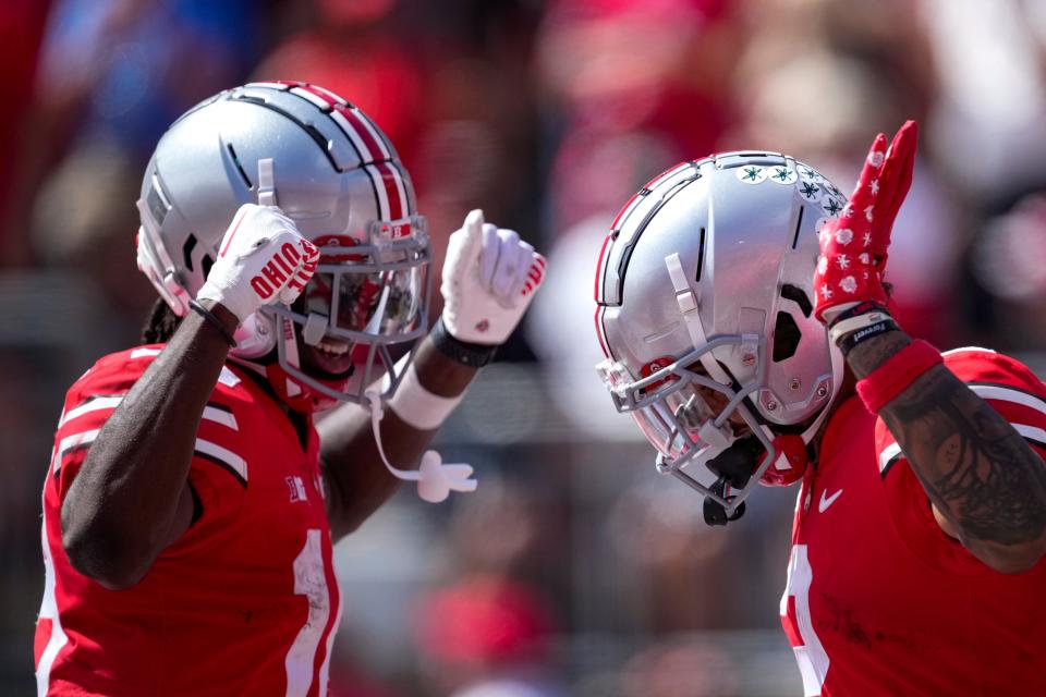 September 10, 2022; Columbus, Ohio, USA; Ohio State Buckeyes wide receiver Emeka Egbuka (2) celebrates with wide receiver Xavier Johnson (10) after scoring a touchdown against the Arkansas State Red Wolves at Ohio Stadium. Mandatory Credit: Joseph Scheller-The Columbus Dispatch