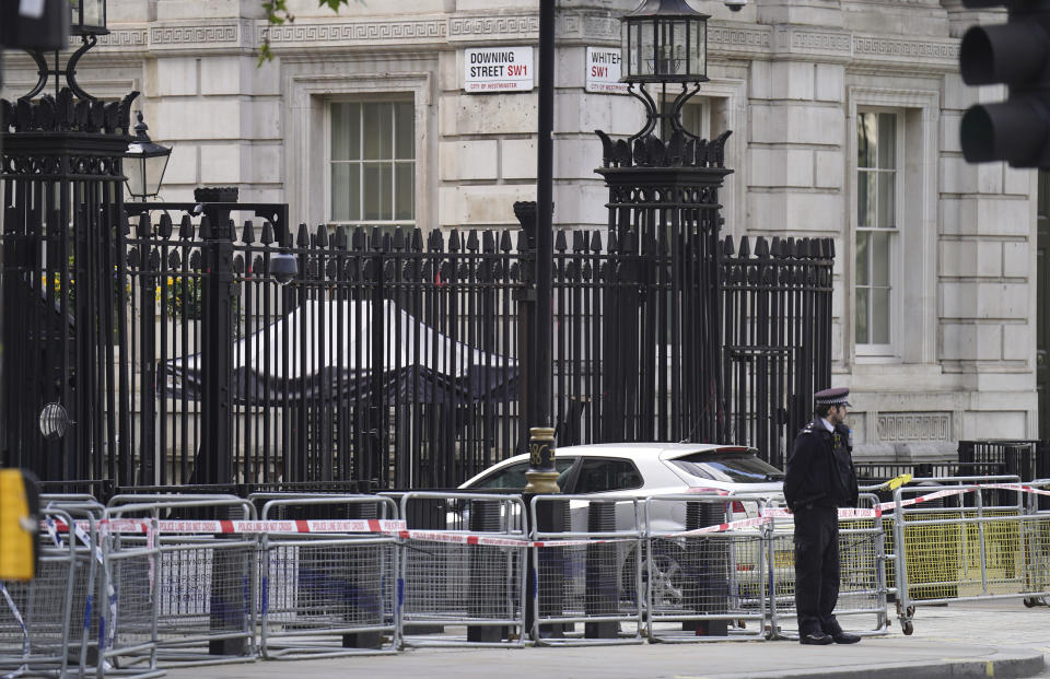 Police at the scene after a car collided with the gates of Downing Street in London, Thursday May 25, 2023. Police say a car has collided with the gates of Downing Street in central London, where the British prime minister’s home and offices are located. The Metropolitan Police force says there are no reports of injuries. Police said a man was arrested at the scene on suspicion of criminal damage and dangerous driving. It was not immediately clear whether the crash was deliberate. (James Manning/PA via AP)