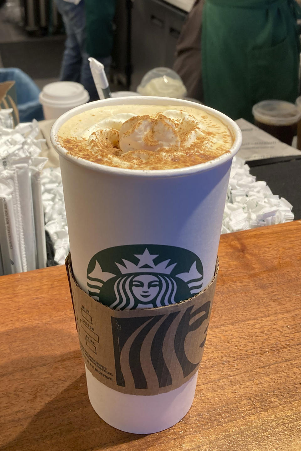 A Pumpkin Spice Latte drink rests on a counter at a Starbucks in New York on Thursday, Aug. 24, 2023. The seasonal drink that made pumpkin spice a star is marking two decades in the world. (AP Photo/Peter Morgan)