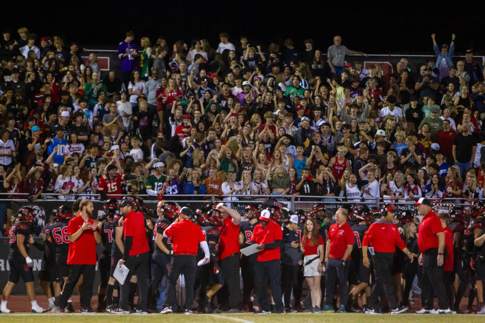 Liberty fans cheer after a touchdown at Liberty High School Football Field in Peoria.