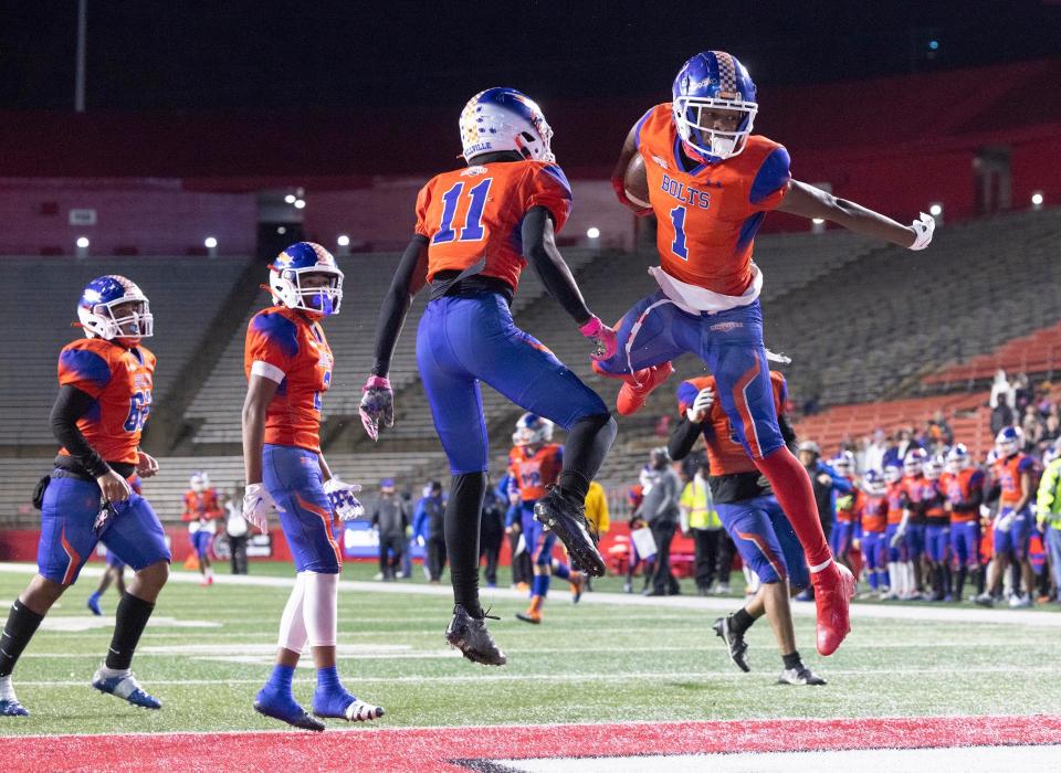 Millville Ta’Ron Haille and Lotzeir Brooks celebrate the first touchdown. Millville Football defeats Northern Highlands 18-14 in NJSIAA Group 4 Final on December 3, 2022 in Piscataway, NJ.