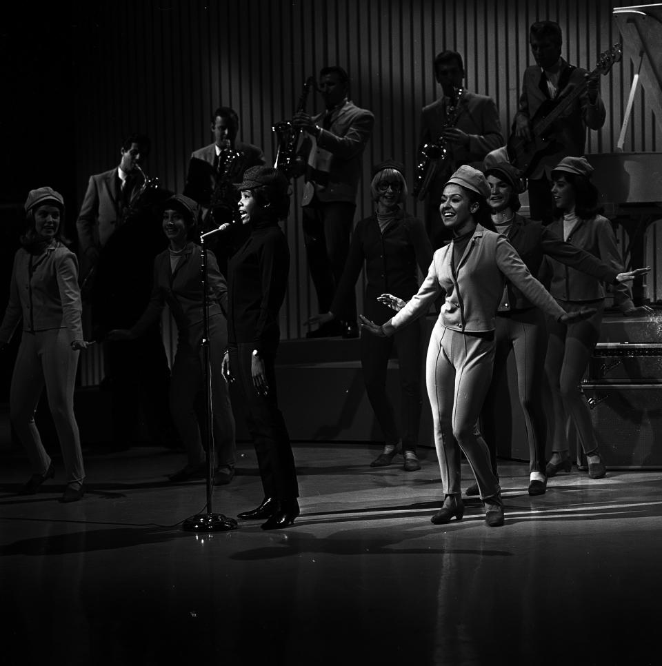 SHINDIG - Airdate: April 4, 1965. (Photo by Walt Disney Television via Getty Images Photo Archives/Walt Disney Television via Getty Images) MILLIE SMALL WITH THE SHINDIG DANCERS (MARIA GAHVA IN FOREGROUND)