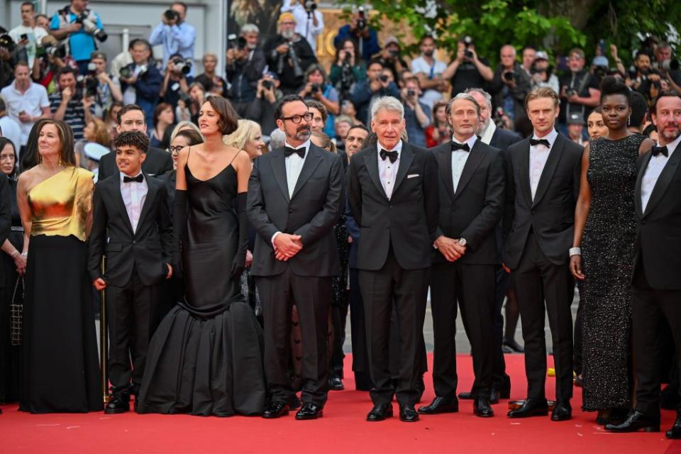cannes, france may 18 kathleen kennedy, ethann isidore, phoebe waller bridge, director james mangold, harrison ford, mads mikkelsen and boyd holbrook attend the indiana jones and the dial of destiny red carpet during the 76th annual cannes film festival at palais des festivals on may 18, 2023 in cannes, france photo by stephane cardinale corbiscorbis via getty images