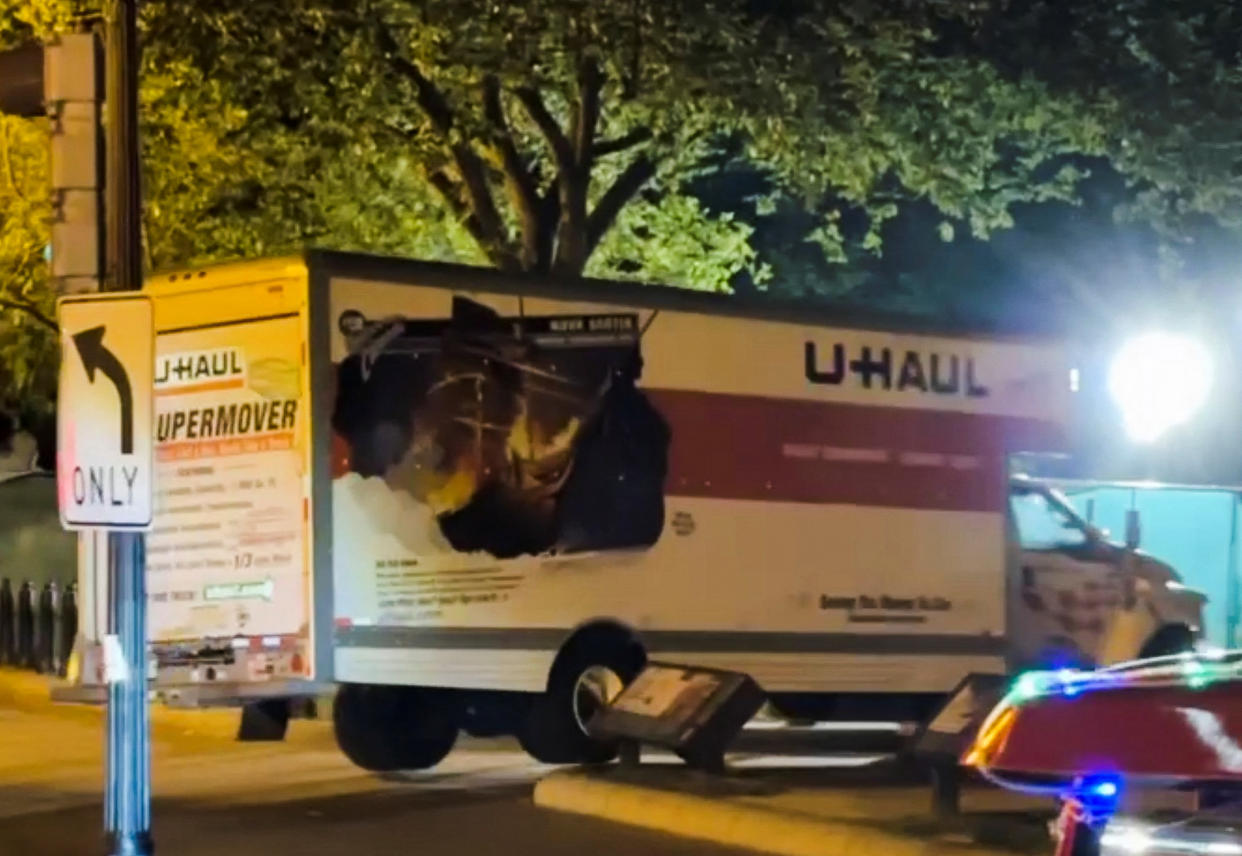 A truck is seen crashing into security barriers around Lafayette Square near the White House on Monday night in this screengrab obtained from a video posted to social media. (Chris Zaboji via Reuters)