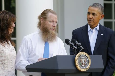 U.S. President Barack Obama watches as Jami Bergdahl (L) and Bob Bergdahl (C) talk about the release of their son, prisoner of war U.S. Army Sergeant Bowe Bergdahl, during a statement in the Rose Garden at the White House in Washington May 31, 2014. REUTERS/Jonathan Ernst