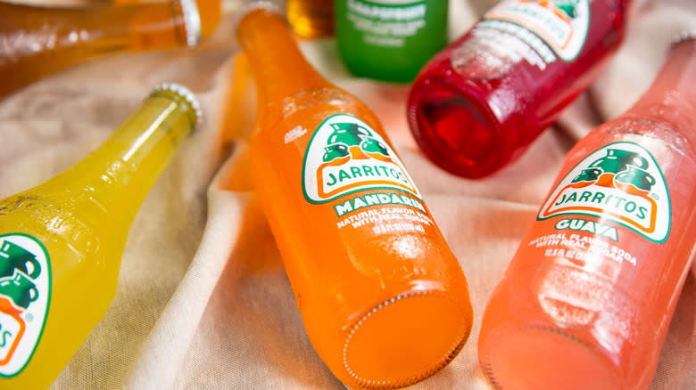 Jarritos soda flavors laying on cloth