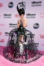 <p>The music star took dramatic dressing to another level in a caged gown that must have been impossible to sit down in. <i>[Photo: Getty]</i> </p>