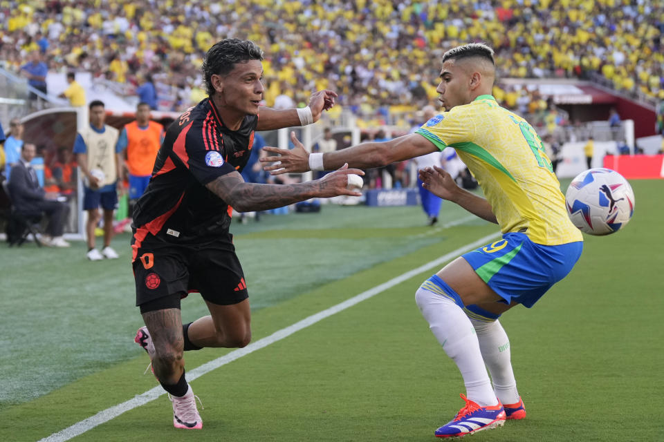 Brazil's Andreas Pereira, right, and Colombia's Richard Rios battle for the ball during a Copa America Group D soccer match in Santa Clara, Calif., Tuesday, July 2, 2024. (AP Photo/Tony Avelar)