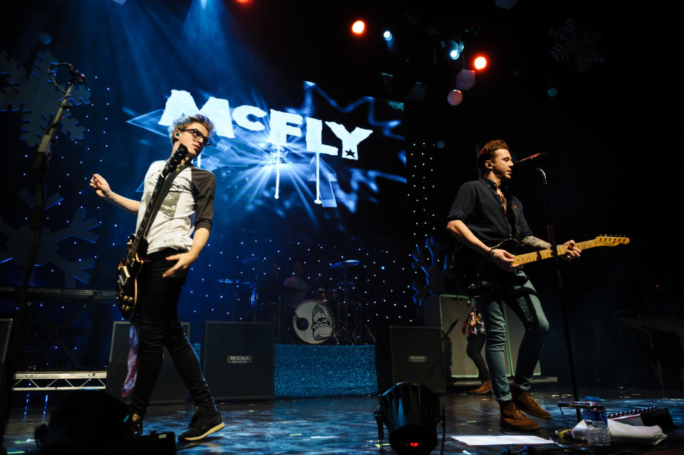 LONDON, UNITED KINGDOM - DECEMBER 03: Tom Fletcher and Dougie Poynter of McFly performs on stage for Magic Sparkle Gala at Indigo2 at O2 Arena on December 3, 2013 in London, United Kingdom. (Photo by Joseph Okpako/Redferns via Getty Images)