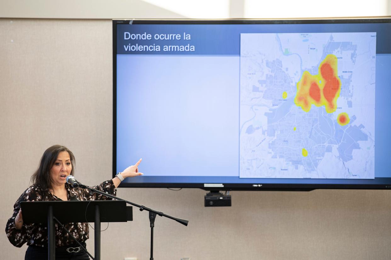 Salem Police public information officer Angela Hedrick discusses crime data during a gun violence forum Friday night at Chemeketa Community College.