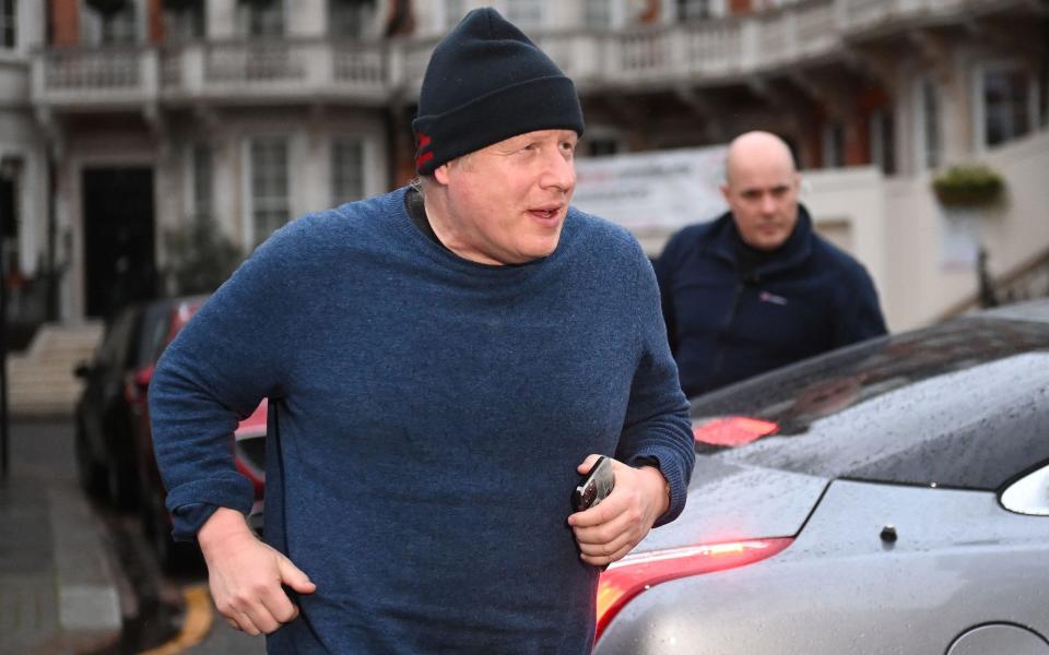 Boris Johnson, the former prime minister, is pictured going for a run this morning ahead of his appearance in front of the Privileges Committee this afternoon - Neil Hall/Shutterstock 
