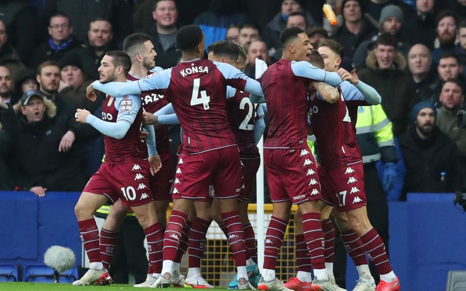 Lucas Digne of Aston Villa (obscured) is hit by an object thrown from the crowd after celebrating their sides first goal during the Premier League match between Everton and Aston Villa at Goodison Park on January 22, 2022 in Liverpool, England. - Getty Images Europe 