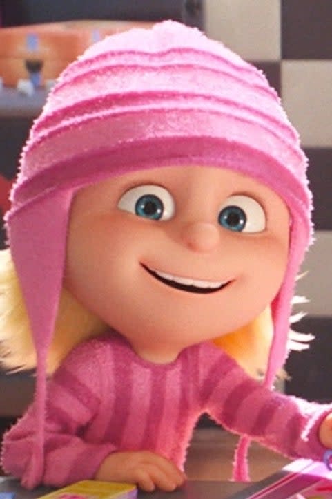 Edith in a pink sweater and hat in 