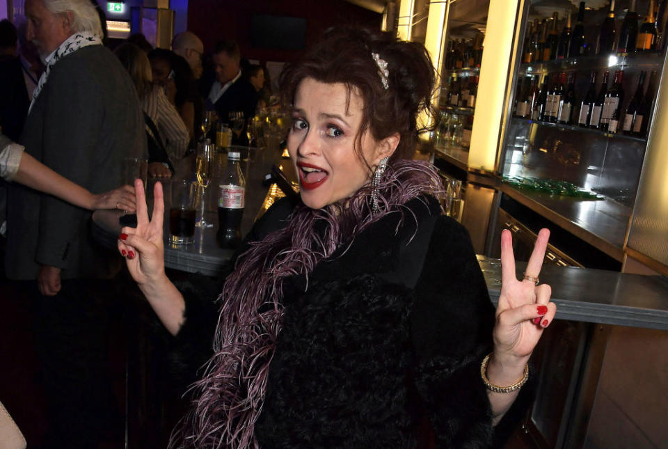 Helena Bonham Carter holding the peace sign