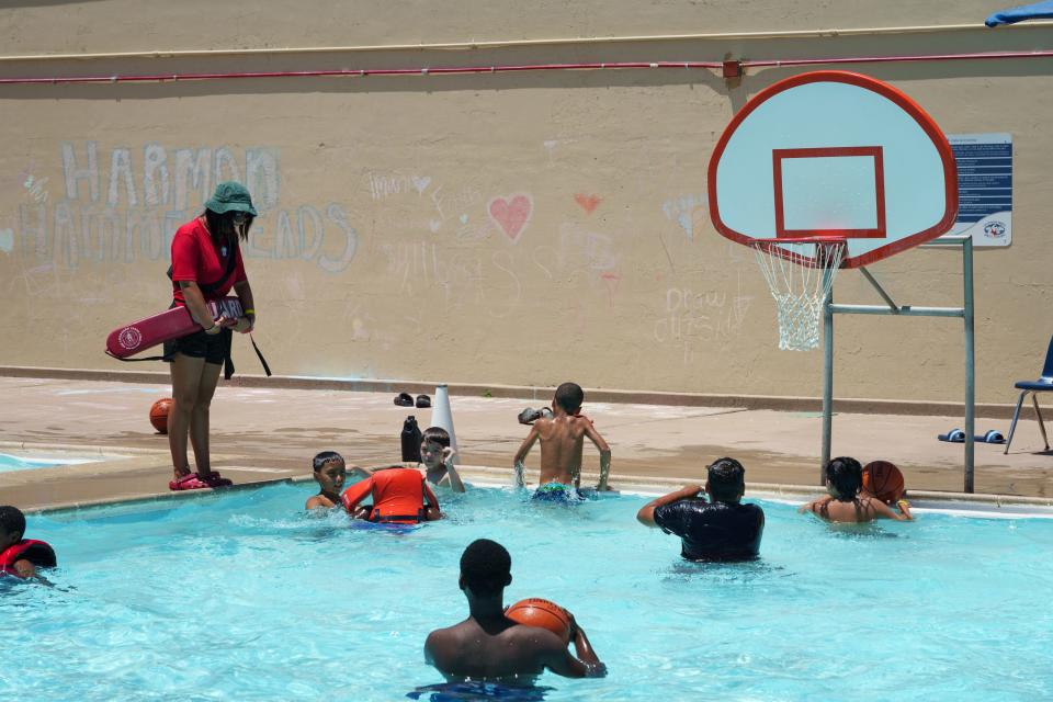 Lifeguard Emily Bergman looks after the kids swimming at Harmon Pool on June 15, 2023, in Phoenix.