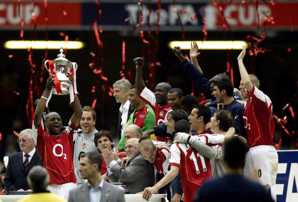 Arsenal captain Patrick Vieira lifts the FA Cup with his team-mates after defeating Manchester United. (Photo by Nick Potts - PA Images/PA Images via Getty Images)