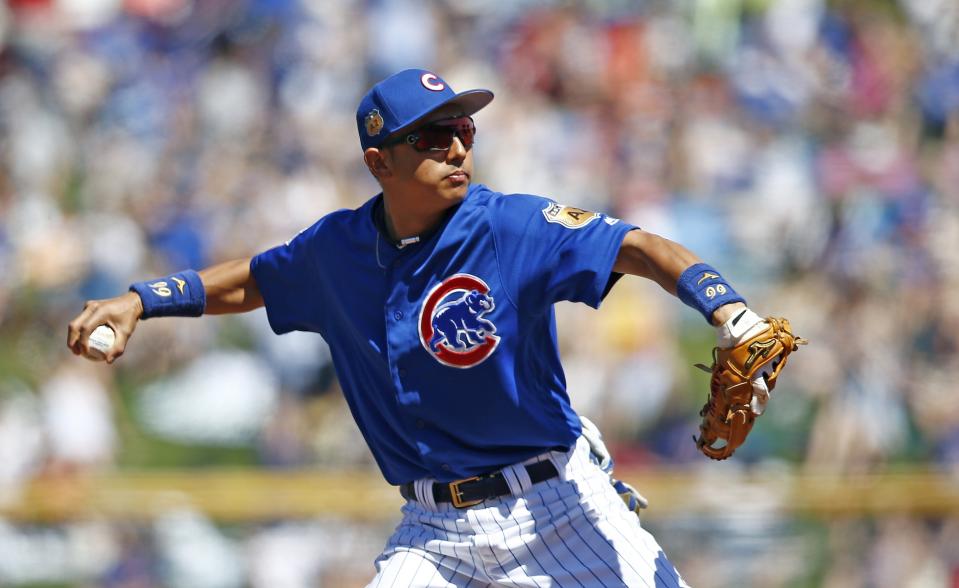 Chicago Cubs shortstop Munenori Kawasaki, of Japan, warms up during the second inning of a spring training baseball game against the Cleveland Indians Friday, March 24, 2017, in Mesa, Ariz. (AP Photo/Ross D. Franklin)