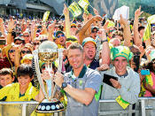 Retiring captain Michael Clarke with the trophy.