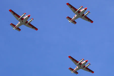 Three units of Beechcraft TC90 aircraft from the Japan Ministry of Defense (JMOD) flies over before arriving for a transfer ceremony of the aircrafts to the Philippine Navy at the Naval Air Group (NAG) headquarters in Sangley Point, Cavite city, south of Manila, Philippines March 26, 2018. REUTERS/Romeo Ranoco