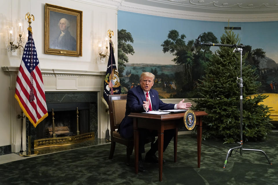 President Donald Trump spoke with reporters following a video chat with members of the military, and the tiny desk he sat at became a meme. (Photo: ASSOCIATED PRESS)