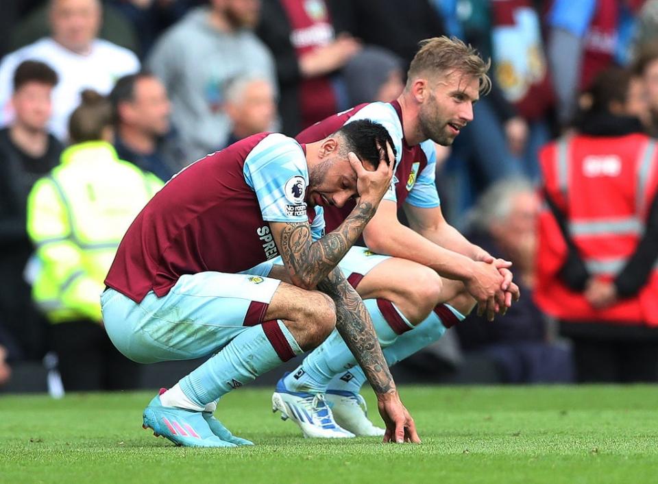 Burnley players react to their relegation from the top flight (Reuters)