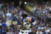 Los Angeles Dodgers catcher Will Smith catches a foul ball hit by Cincinnati Reds' Jeimer Candelario during the fifth inning of a baseball game in Los Angeles, Saturday, May 18, 2024. (AP Photo/Ashley Landis)