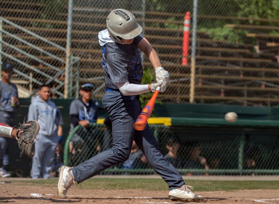 Mountain House's Tommy Neri hits a double during a varsity baseball game against Lodi at Tony Zupo Field in Lodi on Tuesday, May, 9, 2023. Lodi won 6-4.