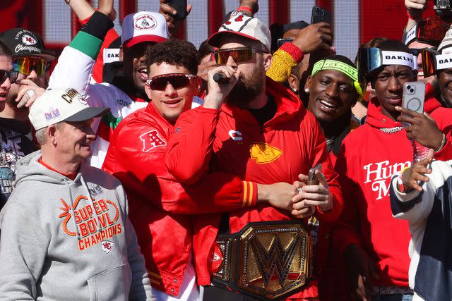 <p>Jamie Squire/Getty </p> Travis Kelce singing at the Super Bowl victory parade