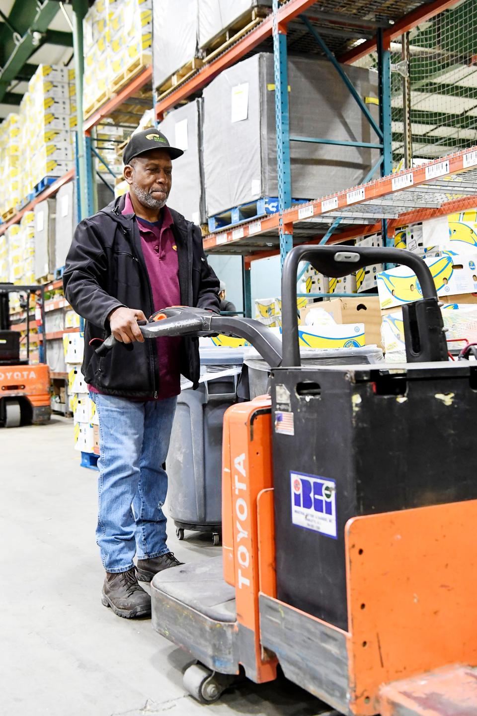 Larry McCullough checks MANNA FoodBank's machinery before volunteers arrive December 17, 2019.