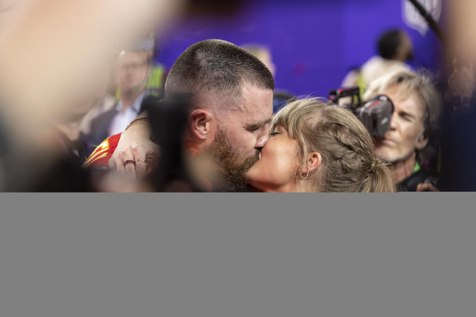 Travis Kelce #87 of the Kansas City Chiefs celebrates and kisses Singer Taylor Swift following the NFL Super Bowl 58 football game between the San Francisco 49ers and the Kansas City Chiefs at Allegiant Stadium on February 11, 2024 in Las Vegas, Nevada.