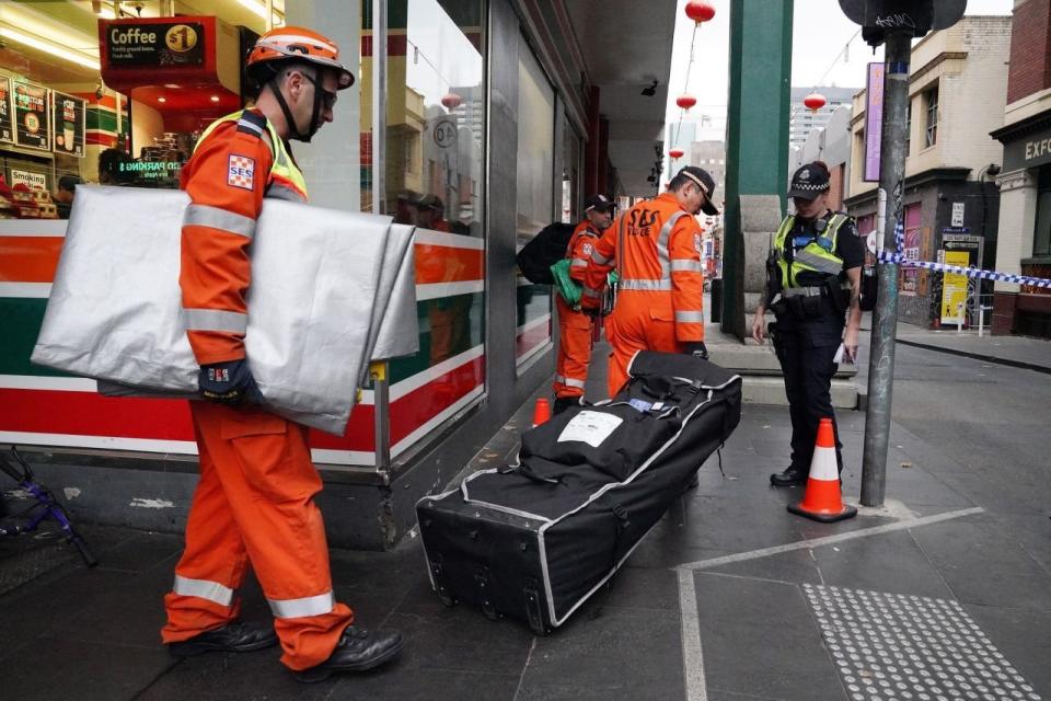 SES officers were seen at Chinatown Wednesday morning after the discovery of a woman's body. Source: AAP