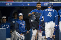 Toronto Blue Jays' George Springer (4) celebrates with Teoscar Hernandez after hitting a home run against the Boston Red Sox during the fifth inning of a baseball game Wednesday, June 29, 2022, in Toronto. (Christopher Katsarov/The Canadian Press via AP)