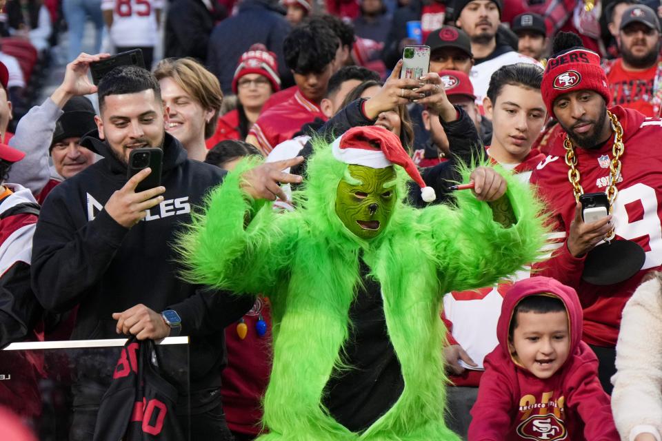 SANTA CLARA, CALIFORNIA - DECEMBER 25: A fan dressed as The Grinch cheers prior to a game between the Baltimore Ravens and the San Francisco 49ers at Levi's Stadium on December 25, 2023 in Santa Clara, California. (Photo by Loren Elliott/Getty Images)