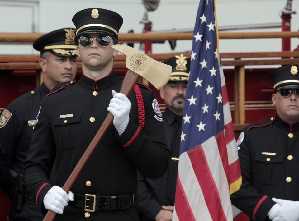 <p>Lt. Victor White of the Miami Beach Fire Department stands at attention during a ceremony on Tuesday, Sept. 11, 2018 honoring those who died during the terrorist attacks on Sept. 11, 2001. Members of the Miami Beach Fire Department, along with City of Miami Beach officials, gathered at Miami Beach Fire Station 2 for a ceremony honoring those who died during the 9/11 terrorist attacks. (Photo: Jose A. Iglesias/el Nuevo Herald/TNS via Getty Images) </p>