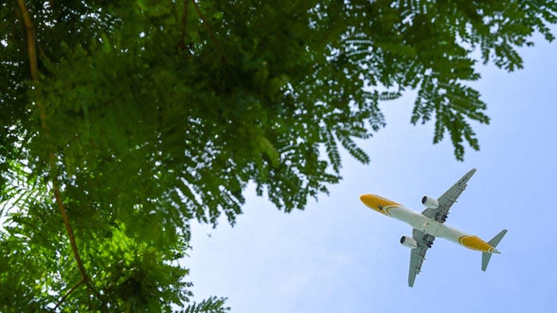 A Scoot commercial passenger jet approaches for landing at Singapore Changi Airport in Singapore on May 2, 2023