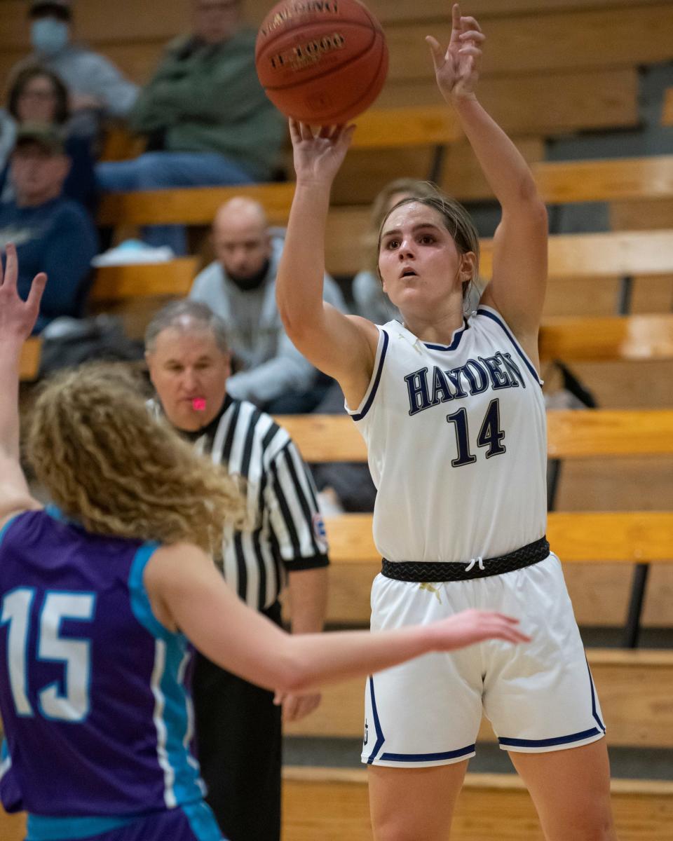 Hayden Carly Stuke (14) shoots the ball Thursday. Stuke is averaging 11.8 points on the season.