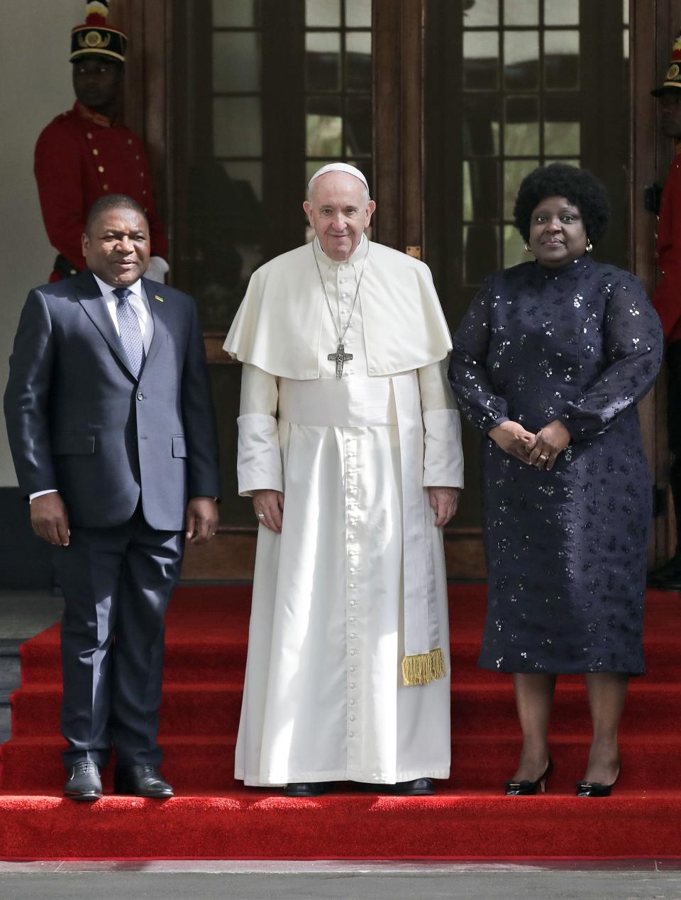 Pope Francis poses with Mozambique President Filipe Jacinto Nyusi, left, and his wife Isaura Nyusi at the Ponta Vermelha Palace on the occasion of their meeting, in Maputo, Mozambique, Thursday, Sept. 5, 2019. Francis is starting his first full day in Mozambique with a speech before government authorities and invited members of the armed opposition who just signed a permanent cease-fire to solidify the country's peace process. (AP Photo/Alessandra Tarantino)