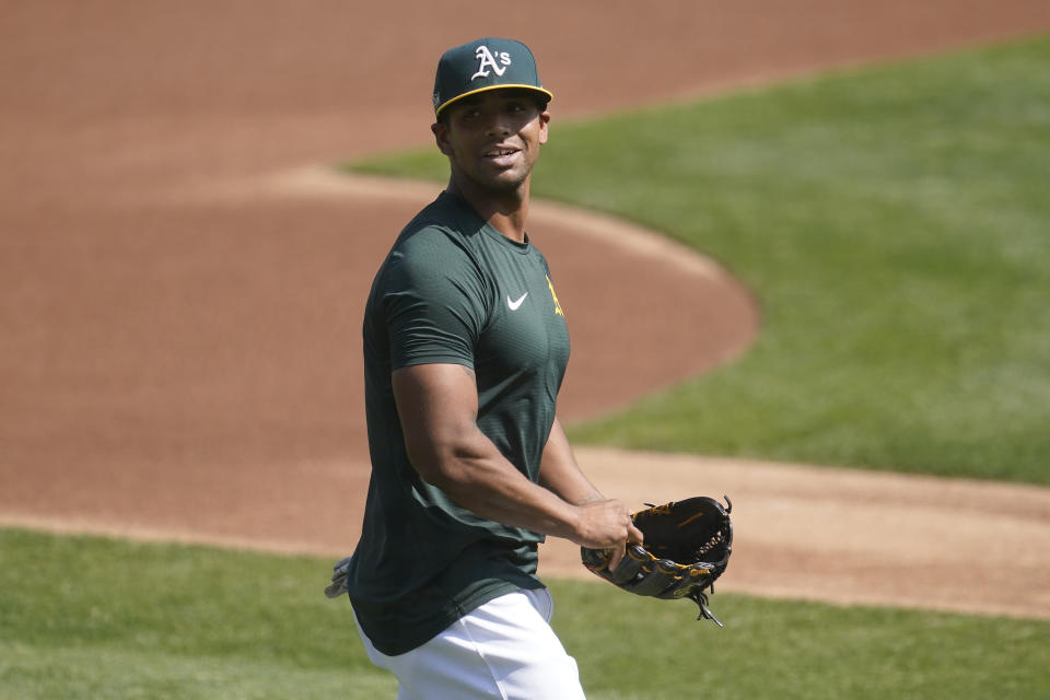 Oakland Athletics' Khris Davis walks onto the field during a baseball workout in Oakland, Calif., Monday, Sept. 28, 2020. The Athletics are scheduled to play the Chicago White Sox in an American League wild-card playoff series starting Tuesday. (AP Photo/Jeff Chiu)