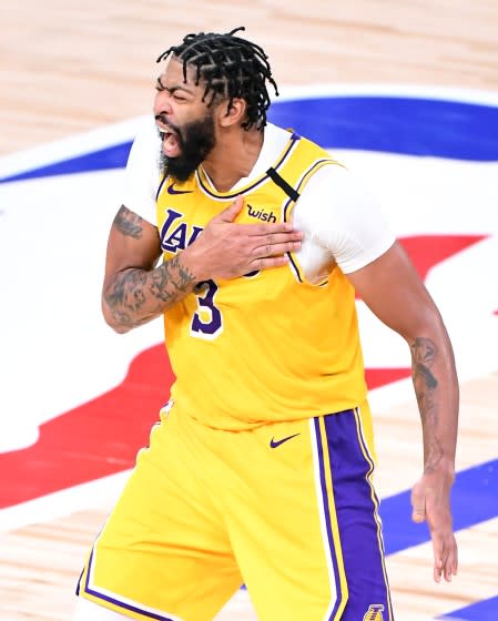 Lakers forward Anthony Davis celebrates his three-pointer against the Heat in Game 4 of the NBA Finals on Oct. 6, 2020.