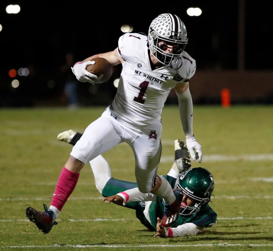 Mt. Whitney's Carter Myers picks up the first down against El Diamante during their high school football game at Visalia Community Stadium in Visalia, Calif., Friday, Oct. 13, 2023.