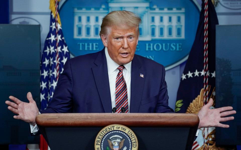 Donald Trump in the White House briefing room - REUTERS