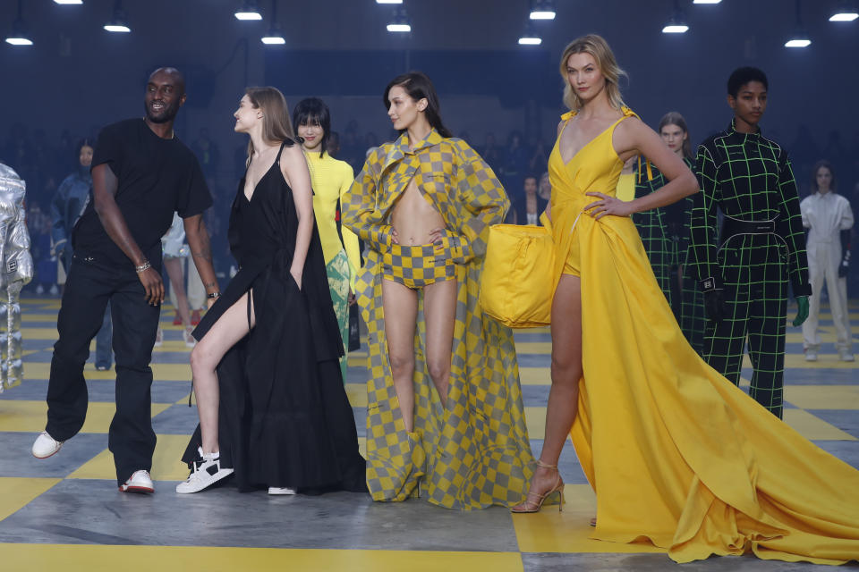 Designer Virgil Abloh, from left, poses with models Gigi Hadid, Bella Hadid and Karlie Kloss at the conclusion of the Off-White ready to wear Fall-Winter 2019-2020 collection, that was presented in Paris, Thursday, Feb. 28, 2019. (AP Photo/Thibault Camus)